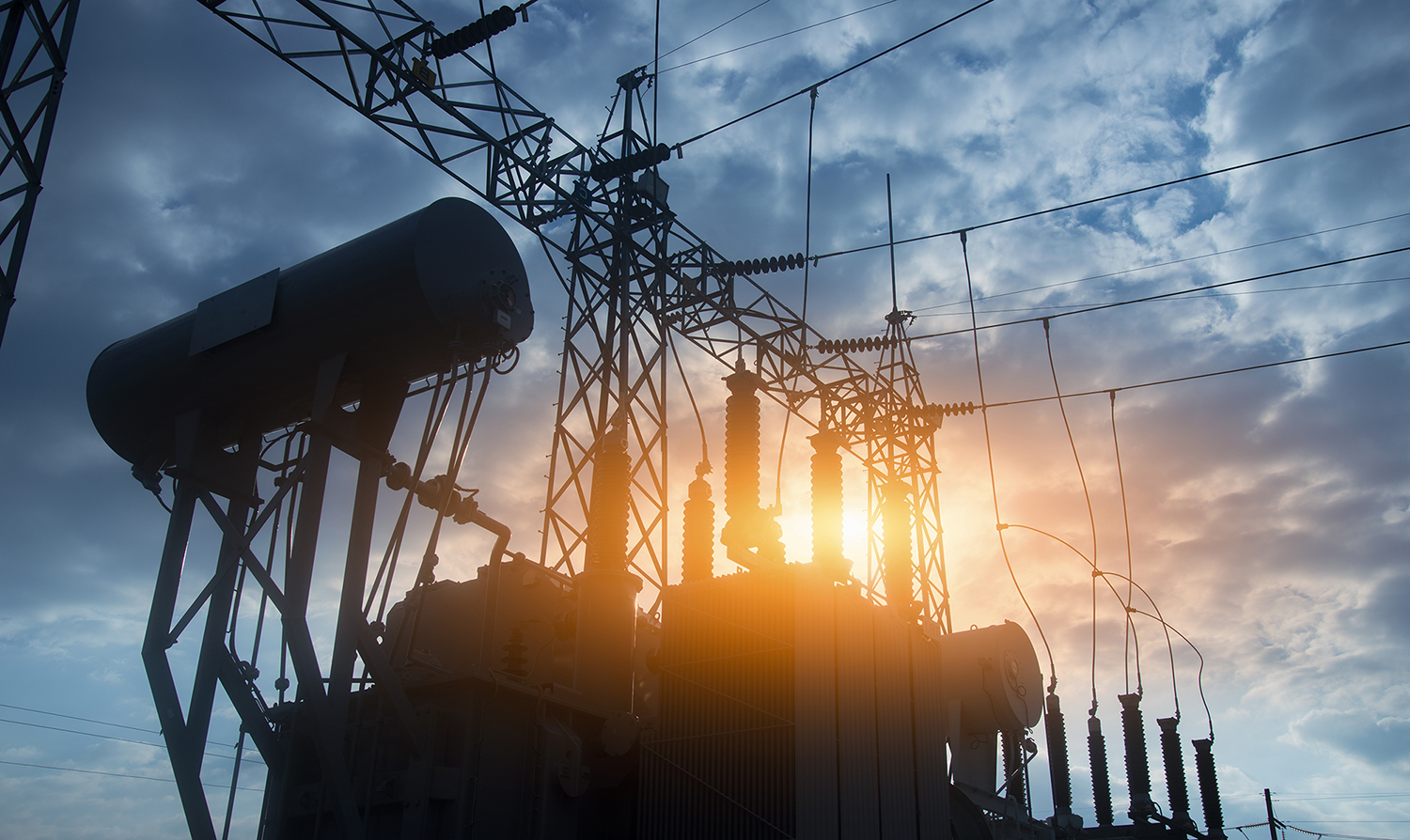 Power infrastructure and transmission equipment at sunset